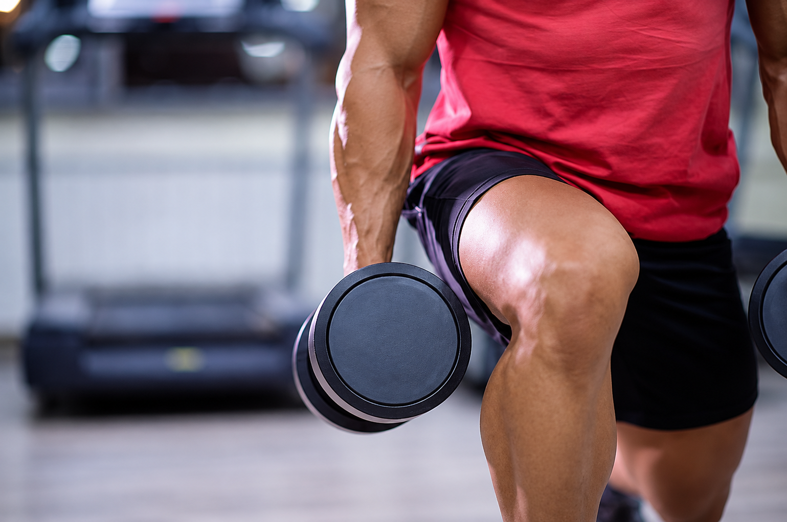 An athlete strength training with dumbbells